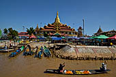 Inle Lake Myanmar. Phaung Daw Oo Paya. Enshrined in the pagoda are five small ancient Buddha images that have been transformed into amorphous blobs by the sheer volume of gold leaf applied by devotees. 